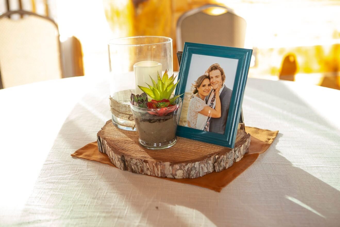 elegant setting from a wedding with framed picture of bride and groom